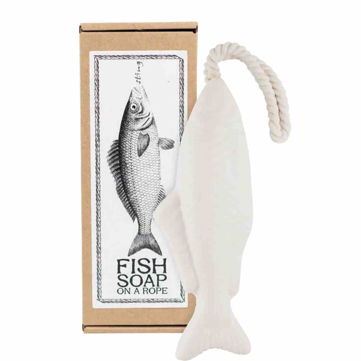 A fish-shaped white soap bar with a rope loop, shown next to its brown cardboard packaging box featuring a black-and-white fish illustration and the text 'FISH SOAP ON A ROPE'.