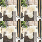 A white fluffy sheepskin throw blanket draped over a brown woven armchair in a bright room with large windows and potted plants.