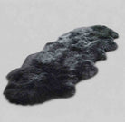 Dark gray fur rug on a light gray background