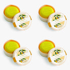 four boxes  of artisanal soap with a lemon design on the label against a white background.