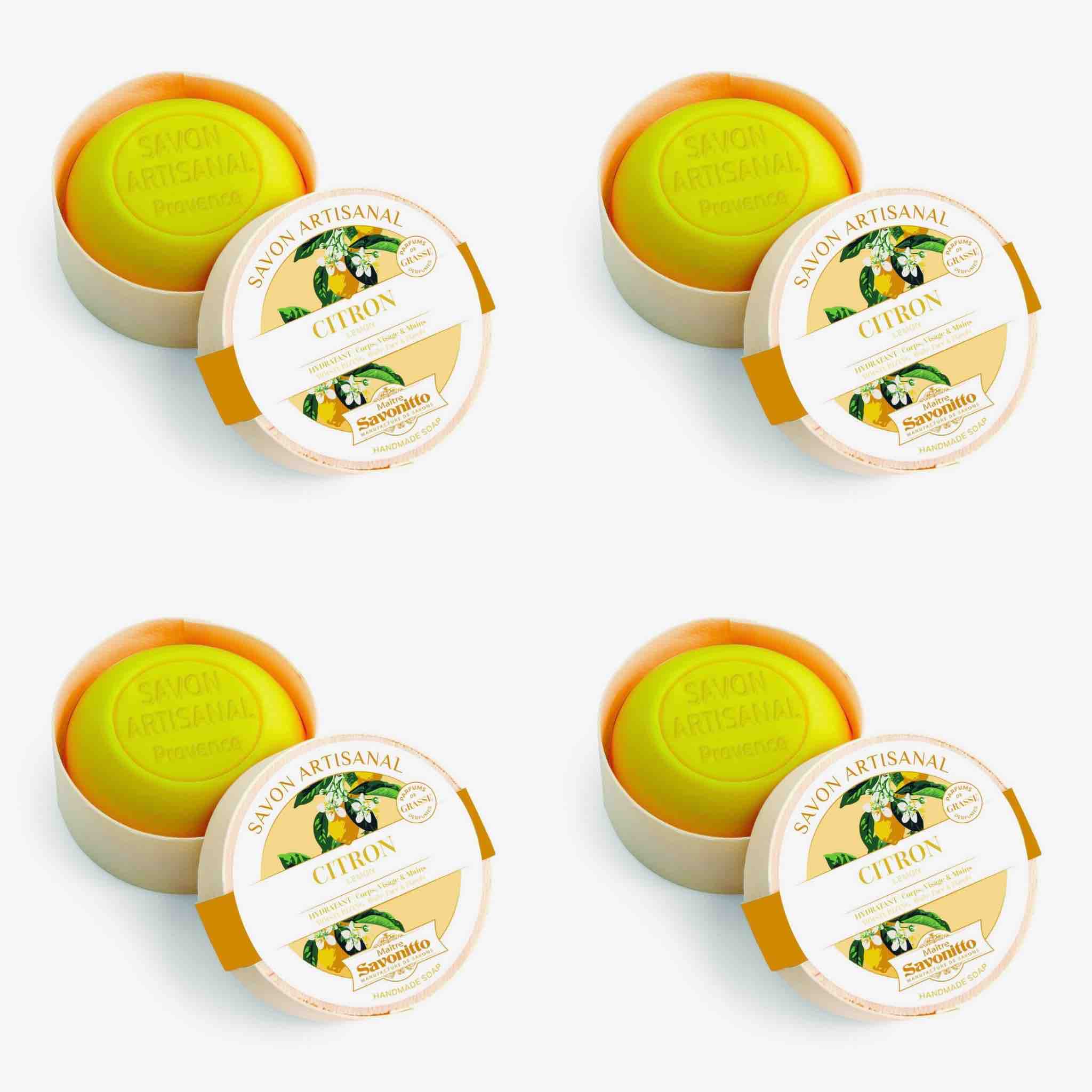 four boxes  of artisanal soap with a lemon design on the label against a white background.