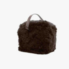 Brown fluffy bag with a handle on a white background