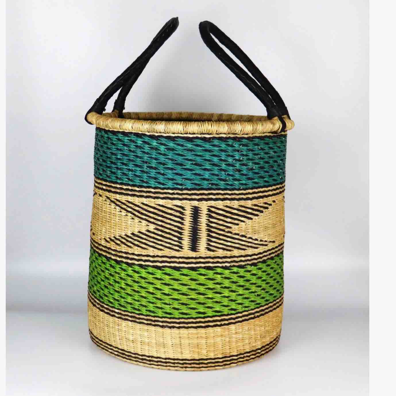Woven basket with black handles on a white background