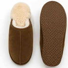 A pair of brown suede slip-on slippers shown on a white background, with one slipper viewed from the top showing a cream-colored shearling lining, and the other shown from the bottom displaying a textured brown sole.