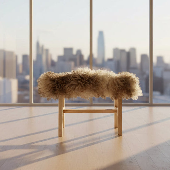 Wooden bench with fluffy fur cover in a minimalistic room.