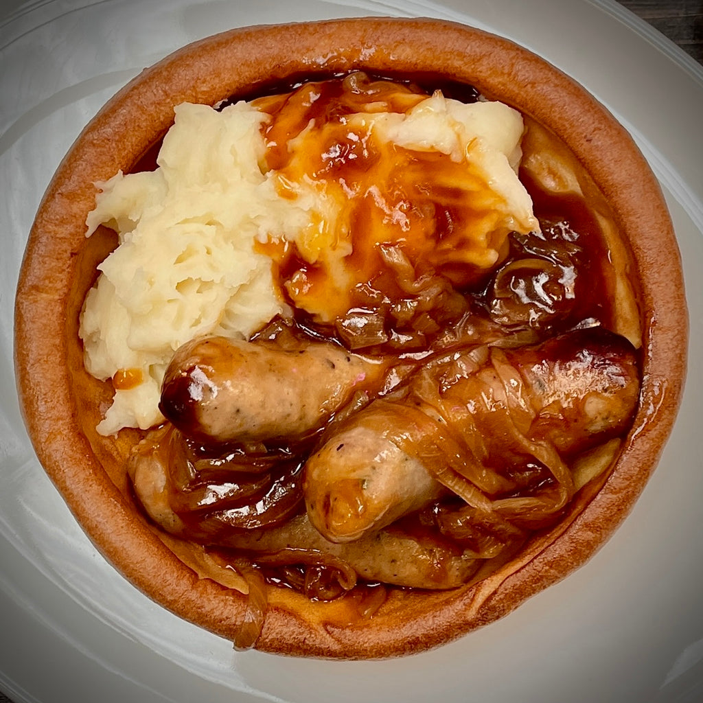 Sausage In Onion Gravy Mashed Potato In A Yorkshire Pudding
