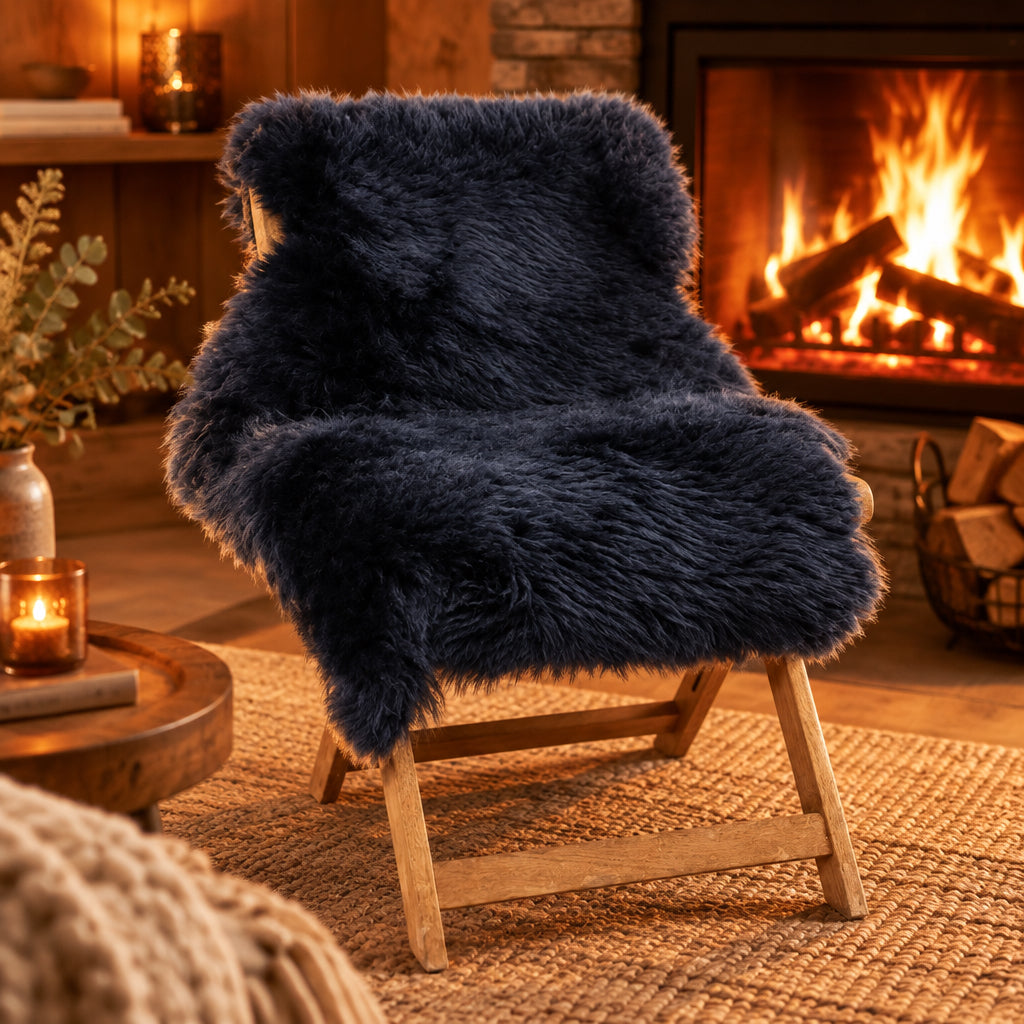 A large sheepskin rug in white, placed on a chair with a fireplace in the background.